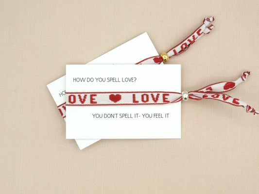 Love, red ribbon bracelet